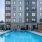 a swimming pool in front of a building