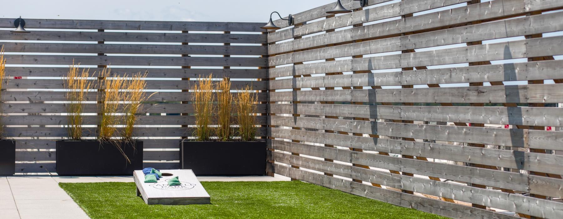 a fence with a planter box and a planter box