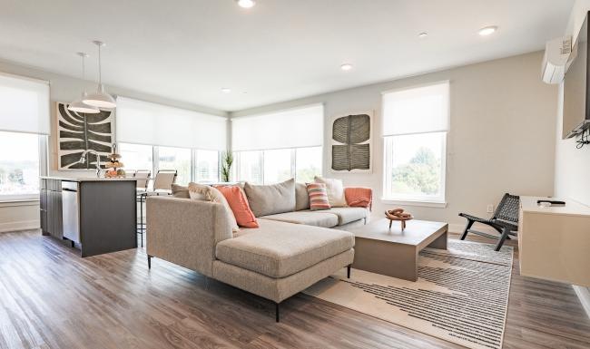 Generous living spaces to relax and unwind a living room with a couch and a rug