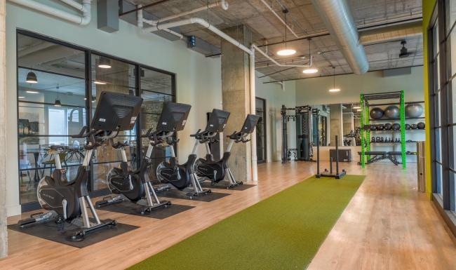 Cutting-edge amenities at your fingertips a gym with exercise equipment