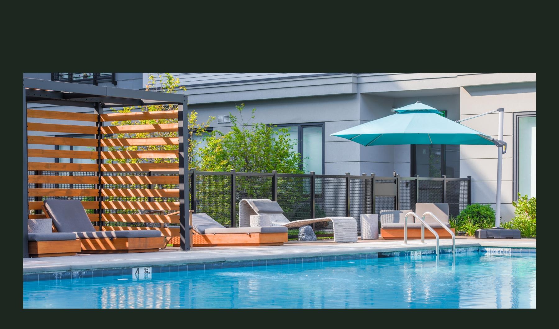 a pool with chairs and umbrellas